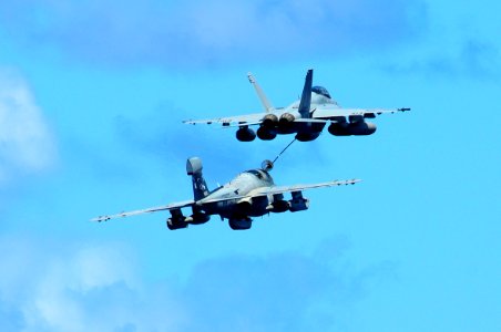US Navy 110904-N-UO379-081 An EA-6B Prowler and an F-A-18F Super Hornet demonstrate a mid-air refueling evolution as they fly near USS Ronald Reaga