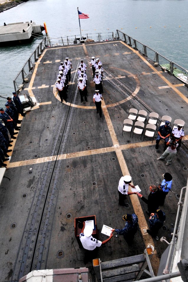 US Navy 110909-N-IZ292-170 Members of the Mauritius Police Force Coast Guard receive certificates during a graduation ceremony aboard USS Samuel B