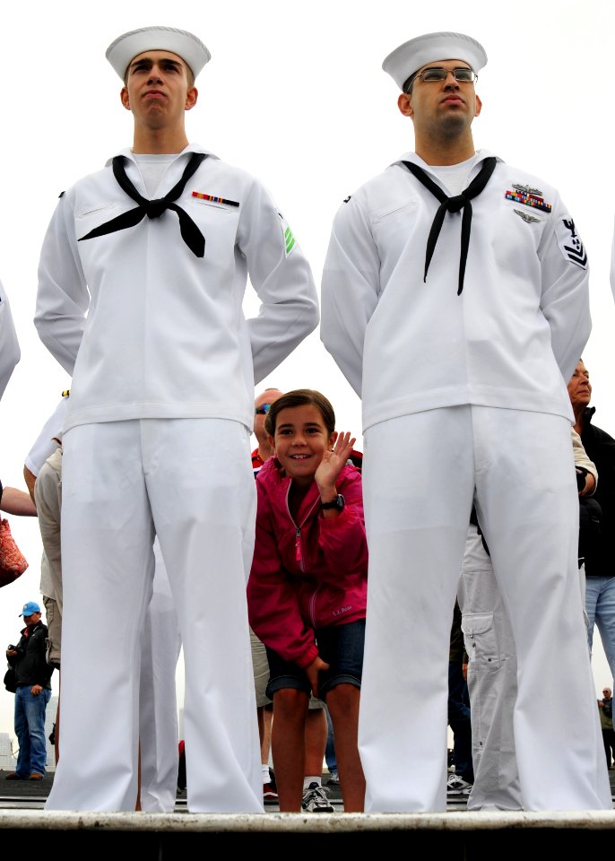 US Navy 110909-N-GL340-016 Sailors man the rails as USS Ronald Reagan (CVN 76) transits the San Diego Bay