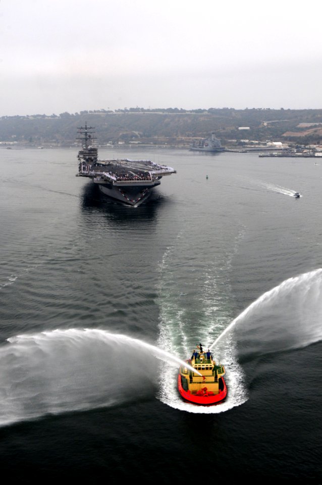 US Navy 110909-N-NB544-833 A tugboat renders honors as transits the San Diego Bay