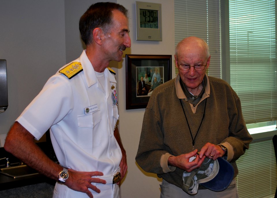 US Navy 110908-N-CI293-057 Rear Adm. Robin M. Watters, chief of staff for U.S. Pacific Command, talks with Alan Simon, chairman of the board of Oma