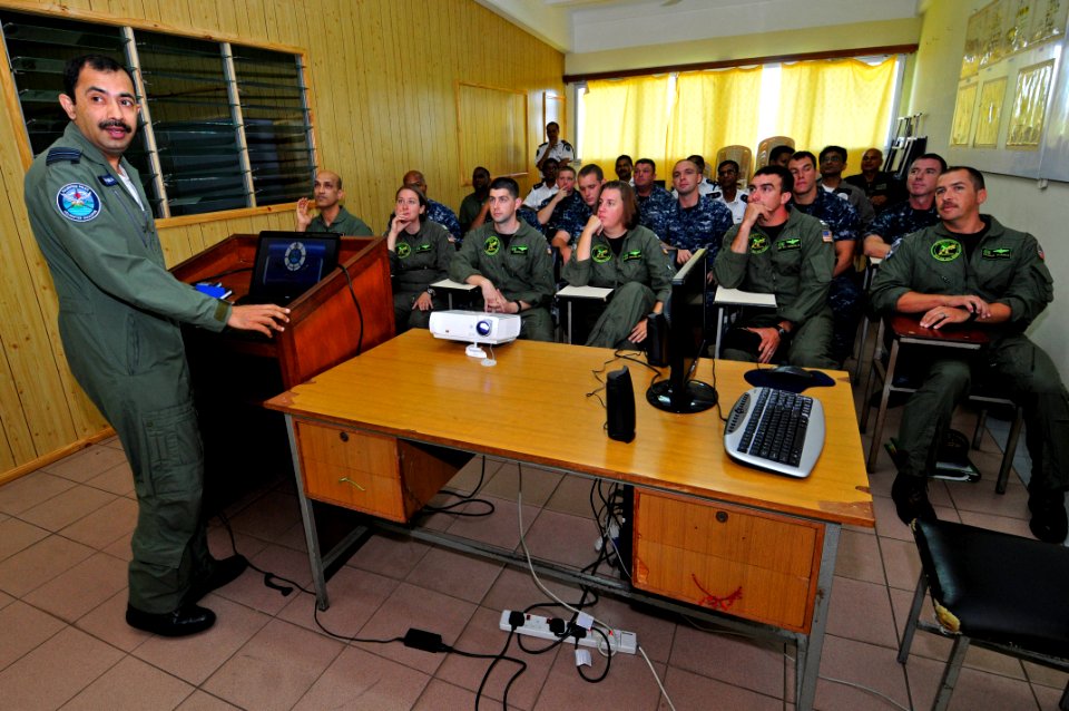 US Navy 110906-N-IZ292-030 Wing Cmdr. Misra Shashank gives a brief to Naval aviators and Sailors during a visit to the Mauritius Police Force Helic