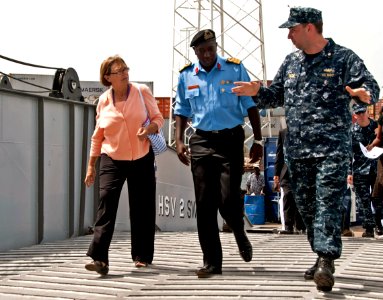 US Navy 110906-N-XK513-059 Lt. Cmdr. Charles Eaton accompanies Commodore Madani Senghore and Cindy Gregg aboard High Speed Vessel Swift (HSV 2)