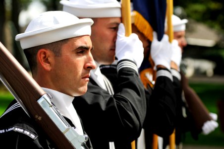 US Navy 110910-N-WP746-331 Operation Specialist 2nd Class Marcos Locero and members of the color guard lead the parade group through the town of Pu