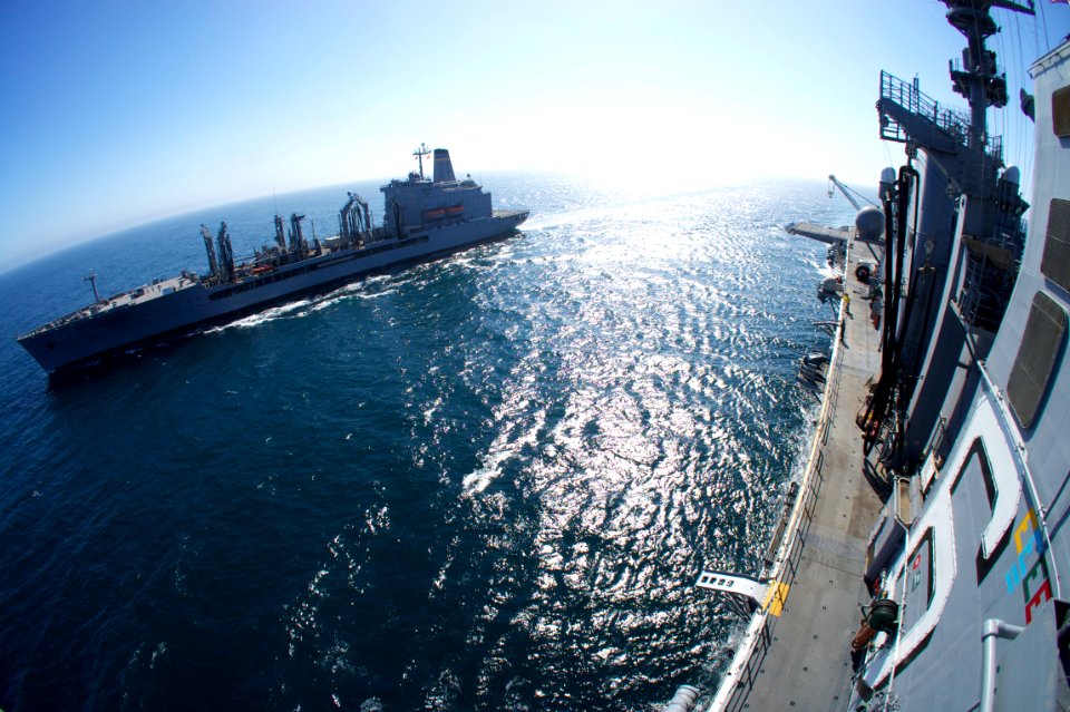 US Navy 110906-N-ZC343-850 The amphibious assault ship USS Bonhomme Richard (LHD 6), right, comes alongside the Military Sealift Command fleet repl