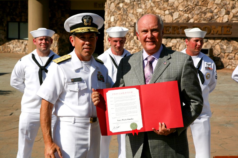 US Navy 110907-N-YM440-244 Rear Adm. Douglas J. McAneny, commandant of the National War College, receives a Navy Week proclamation from Omaha Mayor