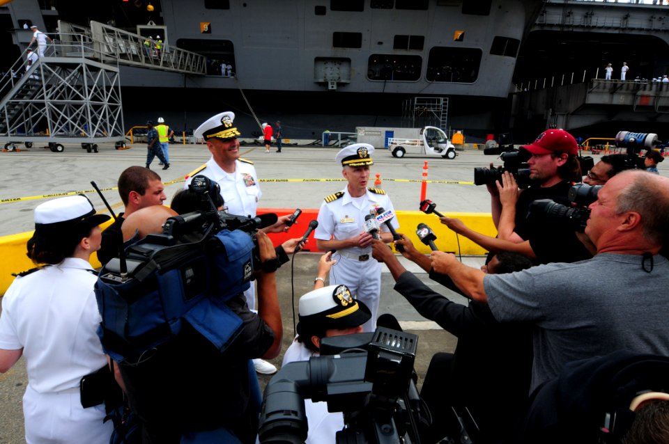 US Navy 110909-N-NB544-274 Rear Adm. Robert Girrier, left, and Capt. Thom Burke answer questions during a media availability after USS Ronald Reaga