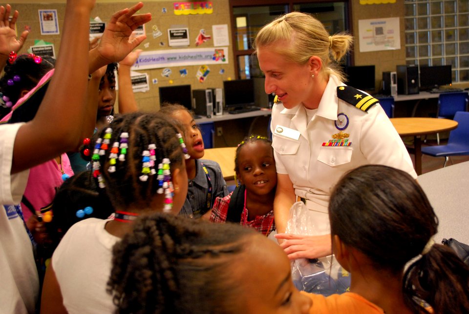 US Navy 110908-N-CI293-077 Lt. Katy Gelenter, an officer recruiter assigned to Navy Recruiting District Omaha, answers questions from girls at the