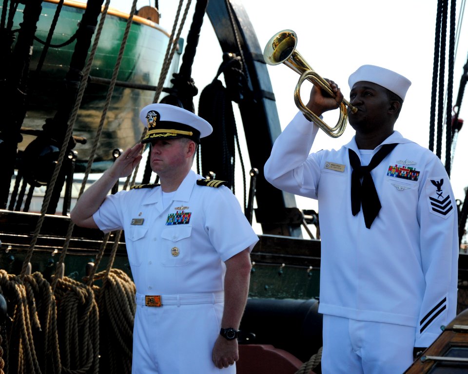 US Navy 110911-N-SH953-219 Cmdr. Matthew Bonner, commanding officer of USS Constitution, renders honors as Yeoman 1st Class Mbanefo Ofodile plays T