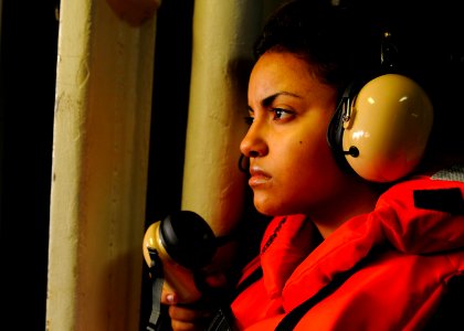 US Navy 110907-N-OK922-068 Seaman Kenia Diaz, assigned to the deck department's 3rd Division, mans a sound-powered telephone during a replenishment