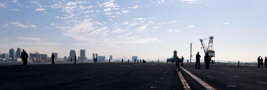 US Navy 110912-N-OK922-018 Sailors watch the San Diego skyline as the Nimitz-class aircraft carrier USS Carl Vinson (CVN 70) departs Naval Air Stat