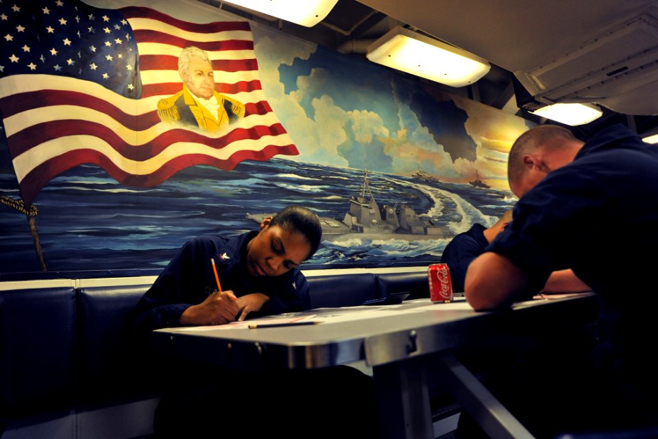 US Navy 110908-N-YZ751-001 Gas Turbine System Technician (Electrical) 3rd Class Bridgett J. Clark takes the E-5 Navy-wide advancement exam aboard U