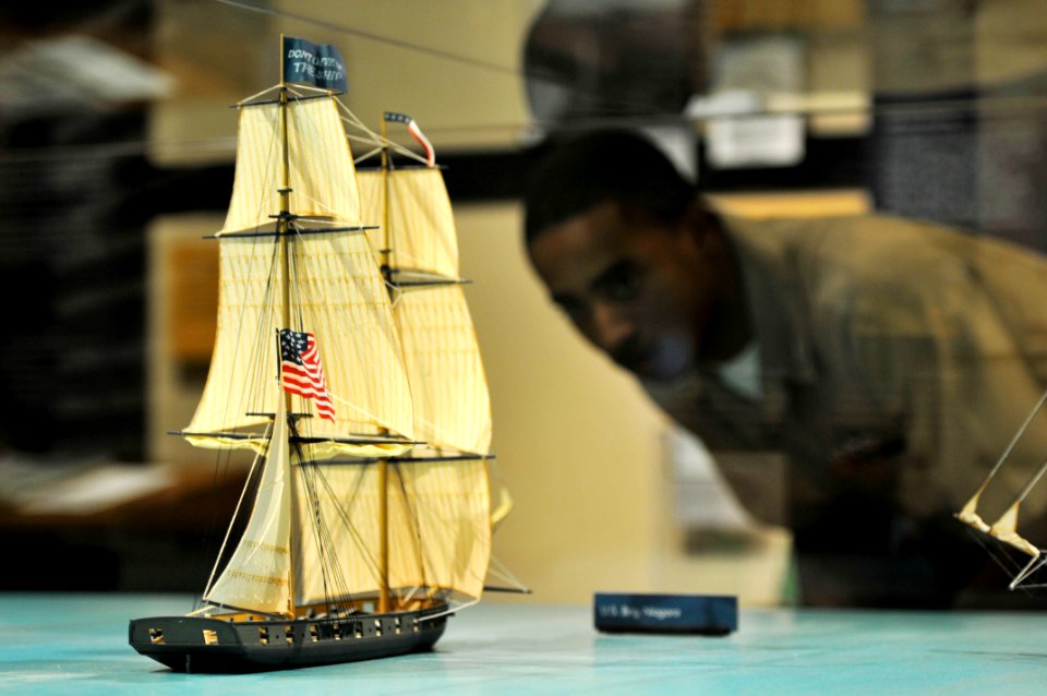 US Navy 110910-N-WP746-093 Fire Controlman 3rd Class Chris Cooke looks at a diorama of US Brig Niagra at the Put-in-Bay Visitor's Center