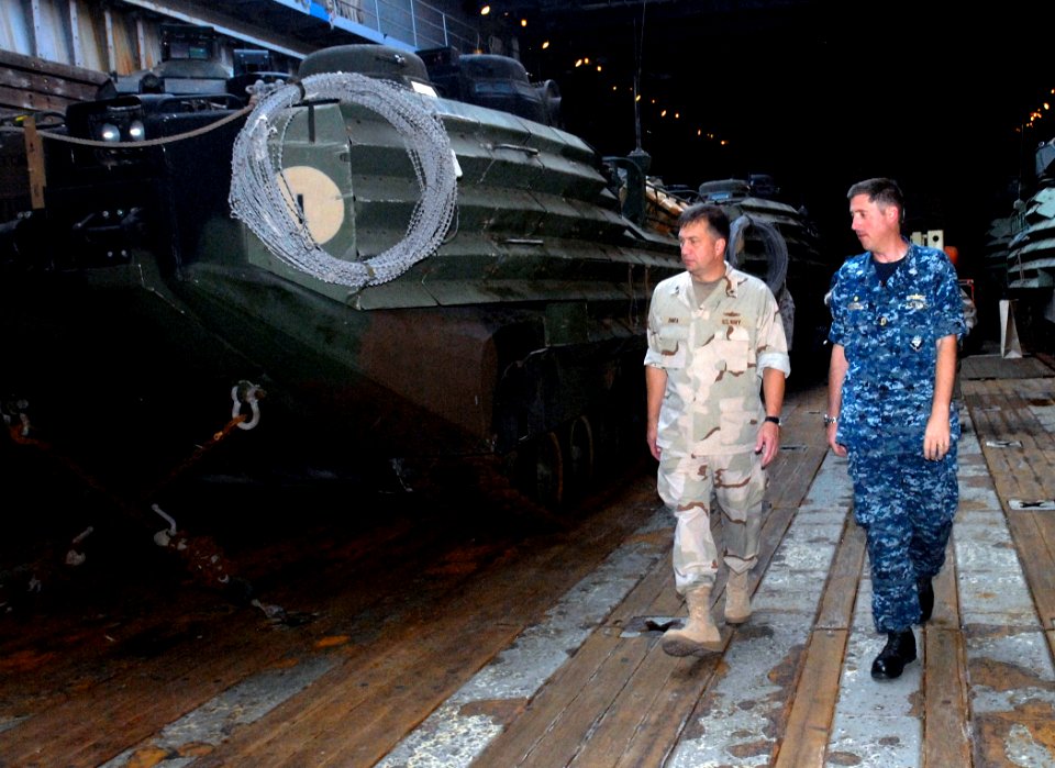 US Navy 110910-N-GH121-095 Cmdr. Eric L. Conzen, commanding officer of the amphibious dock landing ship USS Whidbey Island (LSD 41),