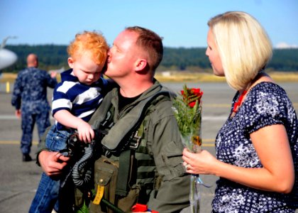 US Navy 110907-N-ZK021-002 Lt. Keith Drown, from Utah, assigned to Electronic Attack Squadron (VAQ) 139, is greeted by family members during a home
