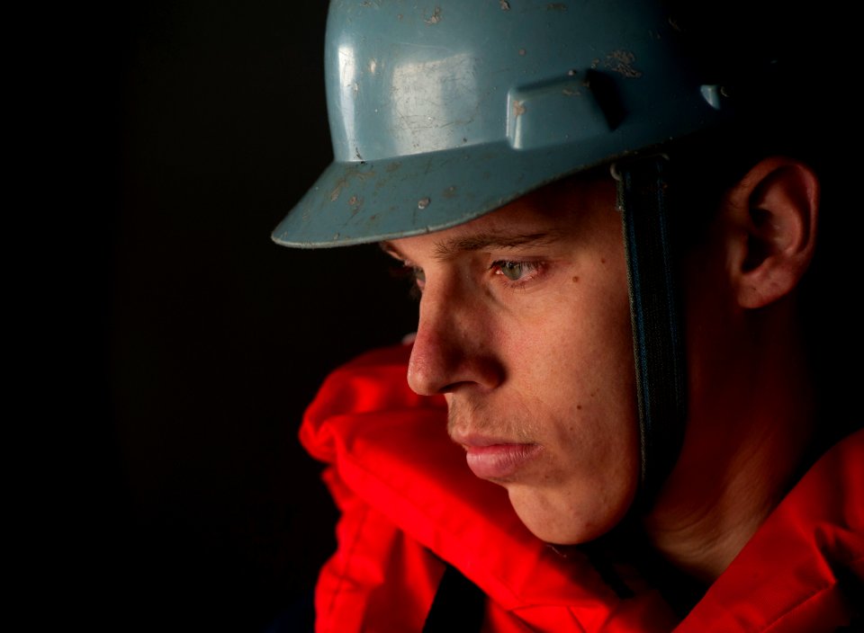 US Navy 110913-N-DR144-321 Seaman Recruit Michael Rigsbee mans a line during a man overboard drill aboard the Nimitz-class aircraft carrier USS Car