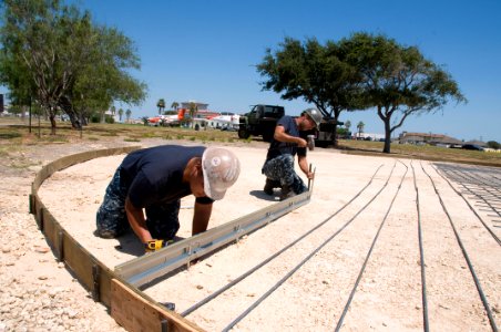 US Navy 110908-N-LY958-049 Seabees lay a foundation for a new static display of an F-A-18 Hornet, used by the U.S. Navy flight demonstration squadr