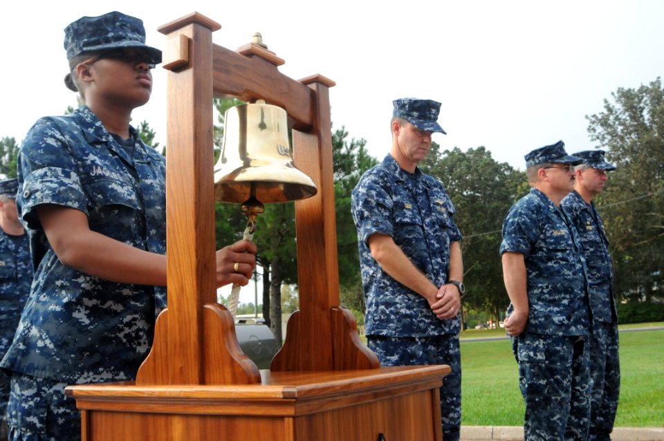US Navy 110909-N-GZ984-038 Religious Programs Specialist Seaman Sha'Quanda Jacobs rings the bell during commemoration ceremony of the Sept. 11, 200 photo