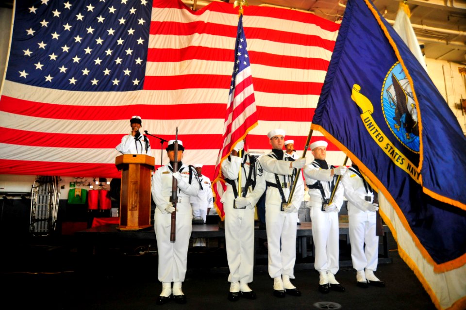 US Navy 110909-N-MH885-010 Color guard members present arms during the national anthem at the start of the Patriot's Day ceremony aboard USS Georg