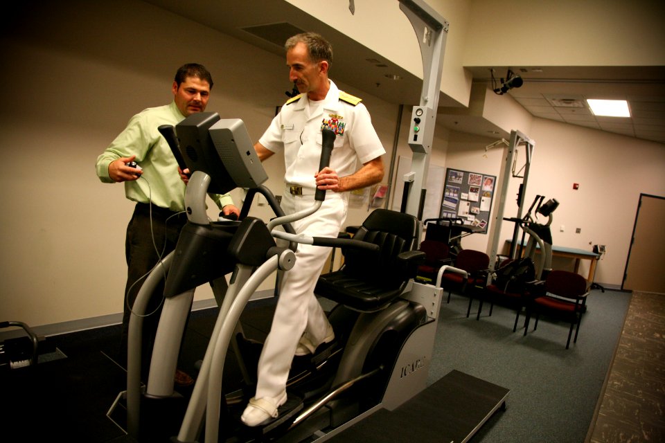US Navy 110909-N-YM440-150 Rear Adm. Robin M. Watters, chief of staff for U.S. Pacific Command, tries a piece of exercise equipment while touring
