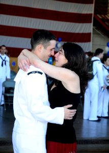 US Navy 110909-N-ZK021-003 viation Structural Mechanic (Equipment) Airman Alexander Hermann hugs a love one during a homecoming ceremony at Naval A