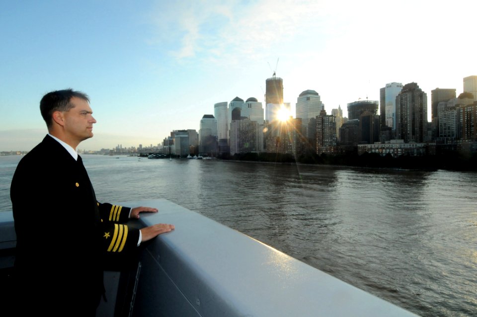 US Navy 110911-N-PR310-001 Cmdr. William Herrmann, commanding officer of the amphibious transport dock ship USS New York (LPD 21) looks towards the