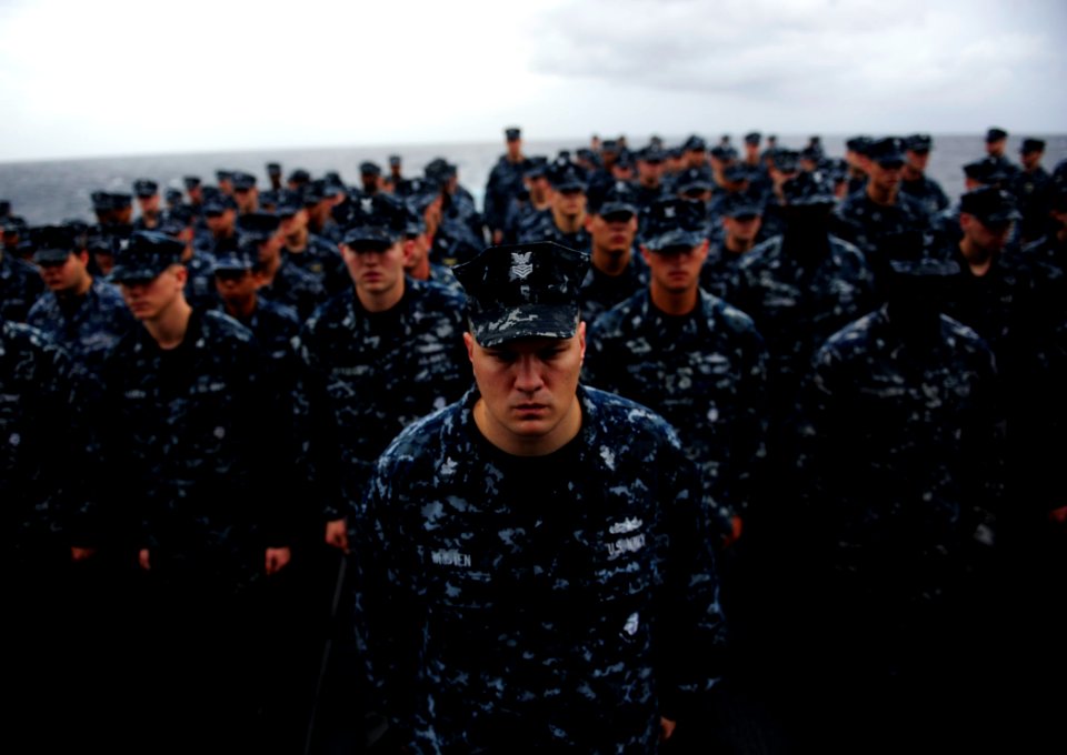 US Navy 110911-N-ZZ999-741 Sailors stand in formation during a 9-11 remembrance ceremony rehearsal aboard USS Mobile Bay (CG 53)