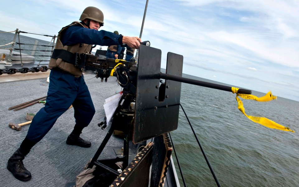 US Navy 110916-N-FI736-032 Sonar Technician (Surface) 2nd Class Adrian Hughes simulates firing on surface contacts during a training exercise aboar