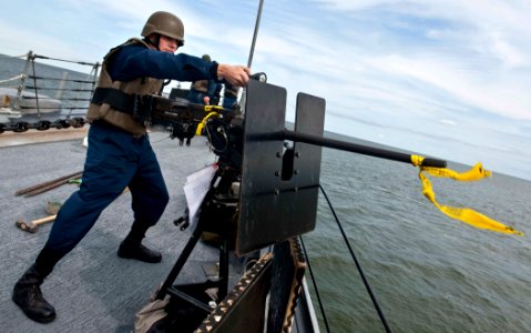 US Navy 110916-N-FI736-032 Sonar Technician (Surface) 2nd Class Adrian Hughes simulates firing on surface contacts during a training exercise aboar