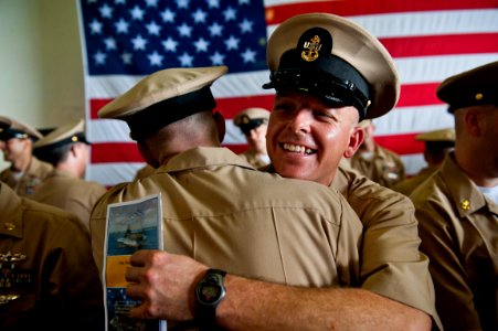 US Navy 110916-N-BT887-250 Chief Aviation Maintenance Administrationman Tait Tanz is congratulated by a fellow chief petty officer at the 2011 chie