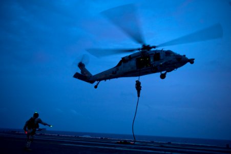 US Navy 110914-N-BT887-533 Sailors assigned to Explosive Ordnance Disposal Mobile Unit (EODMU) 11 fast-rope from an MH-60S Sea Hawk helicopter