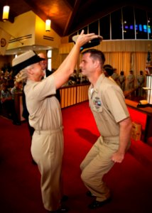 US Navy 110916-N-KK576-198 Chief Mass Communication Specialist Johnny I. Michael receives his combination cover from his sponsor during the 2011 ch
