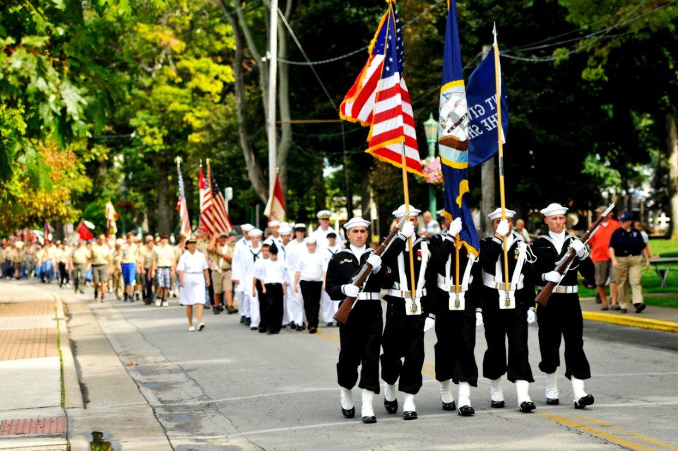 US Navy 110910-N-WP746-350 The color guard assigned to USS Lake Erie (CG 70) leads the parade group through the town of Put-in-Bay