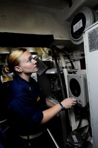US Navy 110913-N-DU438-259 Ensign Caitlin Parks drives the ship from aft steering during a training drill aboard the guided-missile cruiser USS Get