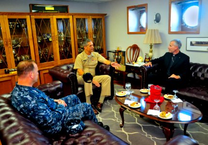 US Navy 110915-N-MH885-002 Capt. David A. Lausman, center, commanding officer of the aircraft carrier USS George Washington (CVN 73)