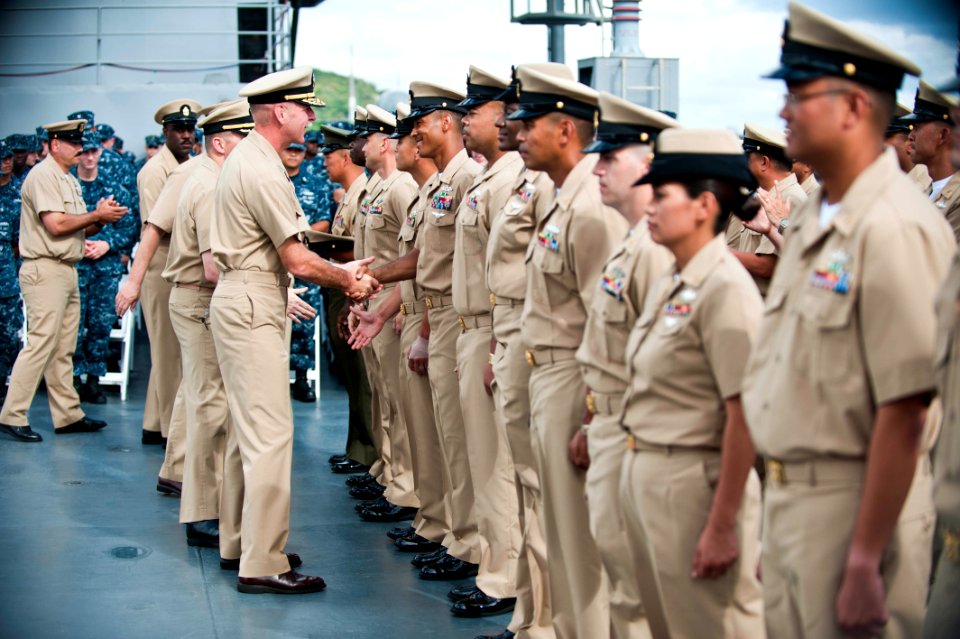 US Navy 110916-N-CZ945-462 Vice Adm. Scott Swift, commander of U.S. 7th Fleet, congratulates chief petty officers
