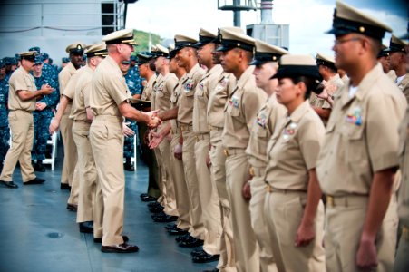 US Navy 110916-N-CZ945-462 Vice Adm. Scott Swift, commander of U.S. 7th Fleet, congratulates chief petty officers