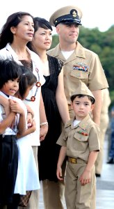 US Navy 110916-N-XG305-837 Chief Electronics Technician Scott Cassin poses for a photograph with his family after a chief petty officer pinning cer