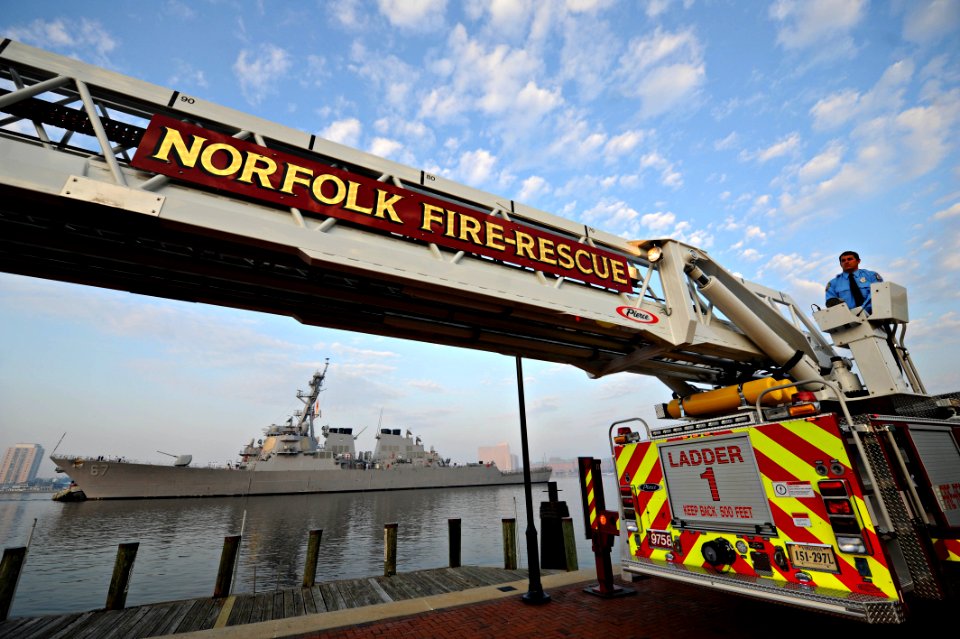 US Navy 110911-N-NY820-067 USS Cole (DDG 67), along with Norfolk emergency response vehicles are the backdrop for a 9-11 Remembrance ceremony at To