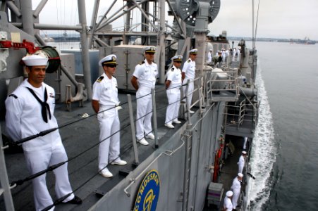 US Navy 110916-N-ZI300-138 Sailors aboard the guided-missile frigate USS Thach (FFG 43) man the rails while arriving in homeport at Naval Base San
