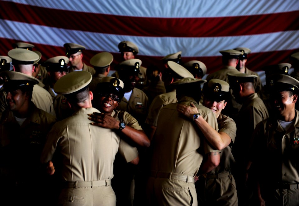 US Navy 110916-N-ZZ999-041 Chief petty officers aboard congratulate newly pinned chiefs following the 2011 chief petty officer pinning ceremony in
