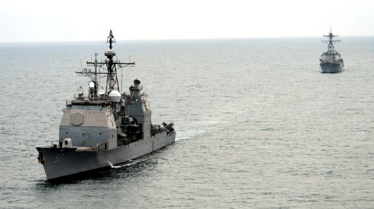 US Navy 110917-N-BC134-316 The guided-missile cruiser USS Bunker Hill (CG 52), left, transits the Pacific Ocean with the Arleigh Burke-class guided