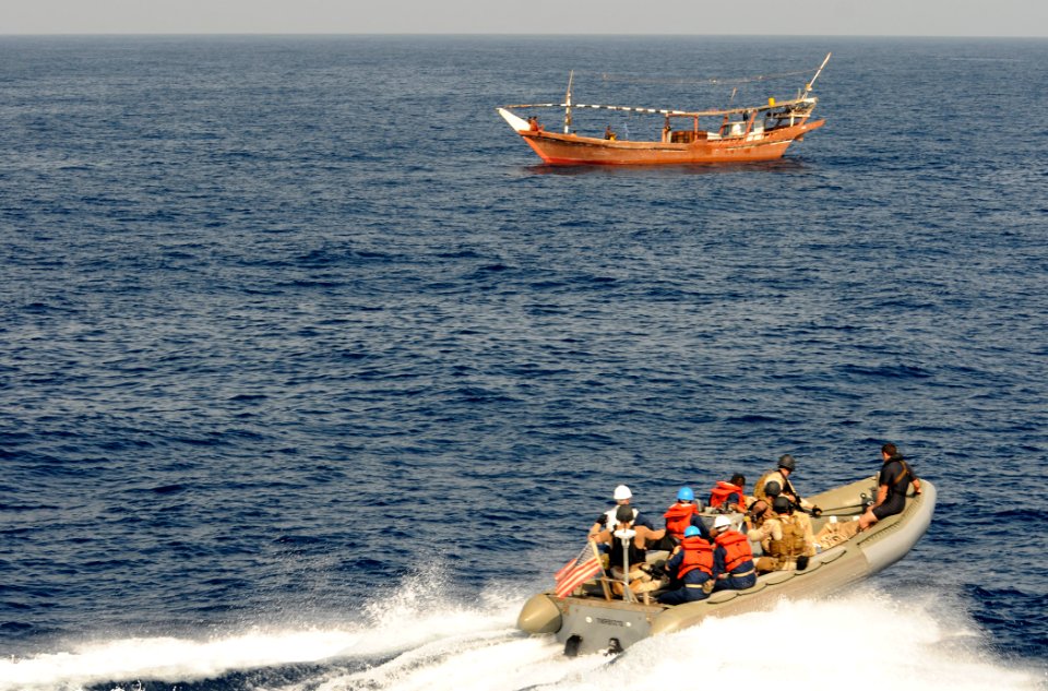 US Navy 110915-N-XQ375-139 Sailors from the guided-missile destroyer USS Mitscher (DDG 57) and members of a Coast Guard advanced interdiction team