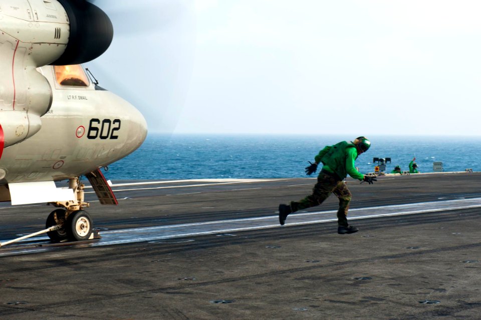 US Navy 110917-N-BT887-377 A Sailor clears the catapult after performing pre-flight checks on an E-2C Hawkeye assigned to the Golden Hawks of Airbo