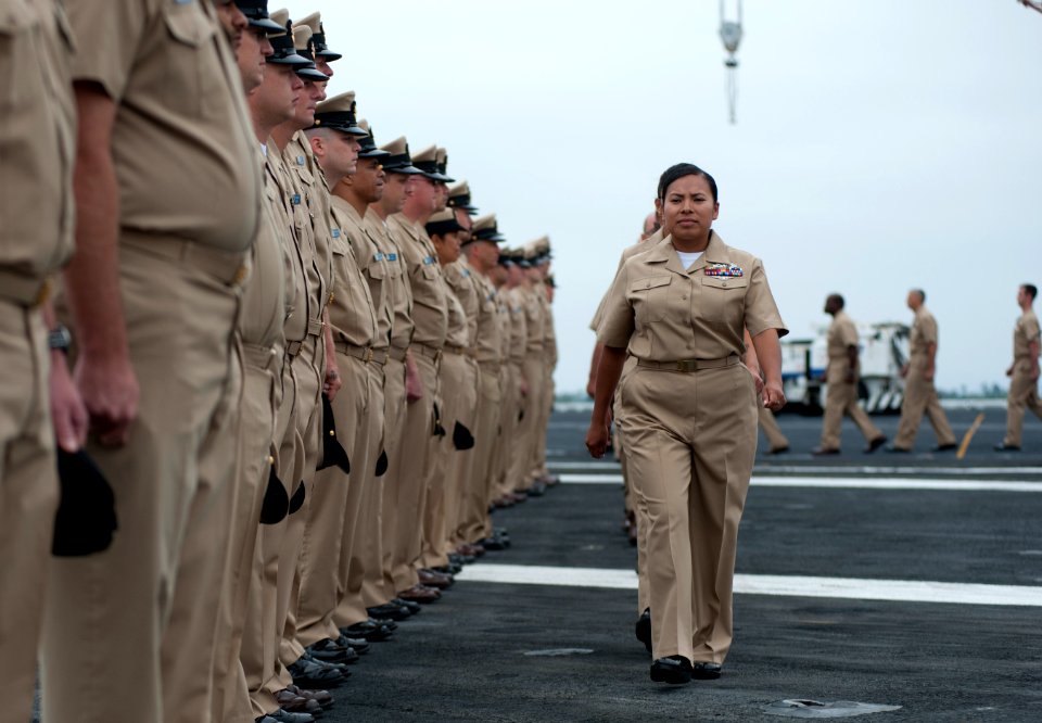 US Navy 110916-N-DR144-107 Chief petty officer selects arrive at the 2011 chief petty officer pinning ceremony aboard USS Carl Vinson (CVN 70)