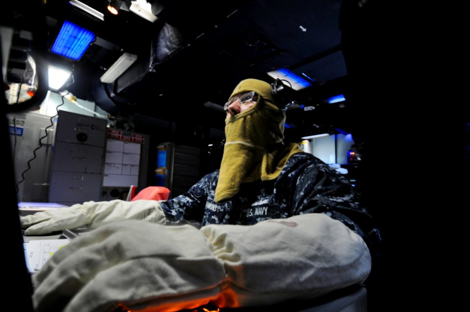 US Navy 110918-N-YM590-054 Sonar Technician (Surface) 2nd Class Jesse Hankins mans the SQR-19B towed sensor operator console during an anti-submari