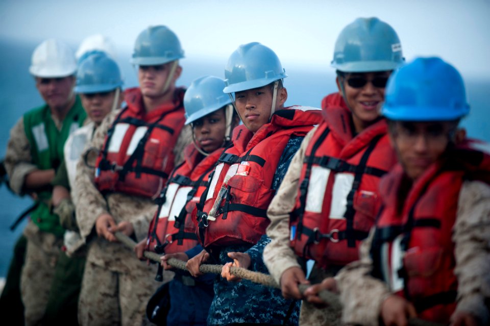 US Navy 110913-N-PB383-107 Sailors and Marines heave a fuel line aboard the San Antonio-class amphibious transport dock ship USS New Orleans (LPD 1
