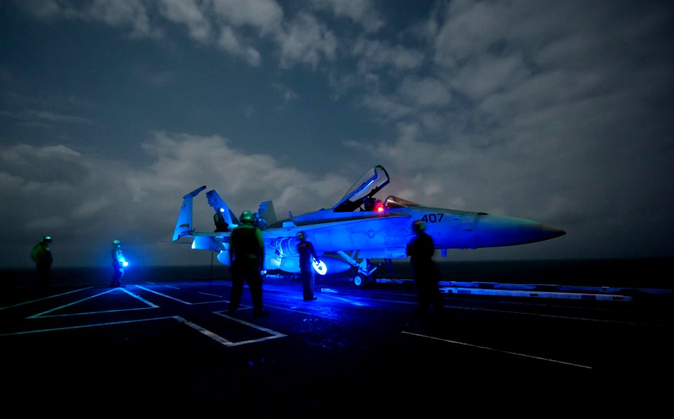 US Navy 110916-N-GC412-211 Sailors stand by while performing low power turns on an F-A18C Hornet