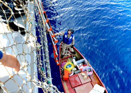 US Navy 110913-N-VH839-026 Fire Controlman 3rd Class Matthew Burger, a visit, board, search and seizure (VBSS) first climber aboard the Arleigh Bur