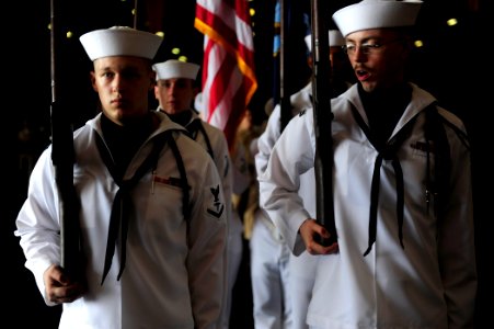 US Navy 110916-N-ZZ999-002 Ship's Serviceman Seaman Albert Sawyer orders arms while parading the colors prior to the 2011 chief petty officer pinni